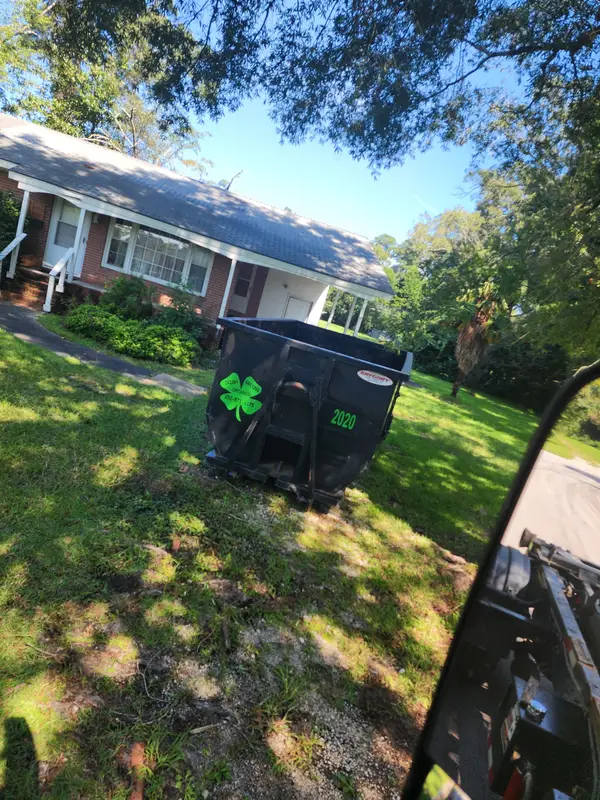 Irish Greens container 2020 on the lawn in front of a brick house